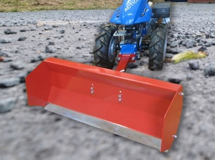 Leveling blades for two-wheel tractors